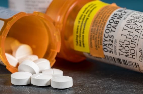 bottle of prescription opioids- Symptoms of Opioid Addiction