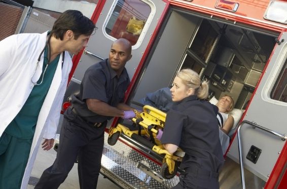 medics and doctor unloading a drug overdose patient in an ambulance for drug overdose