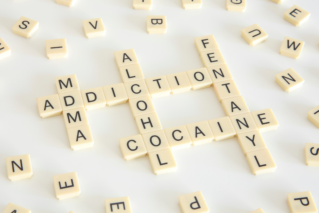 scrabble letters that are all connected to the word addiction