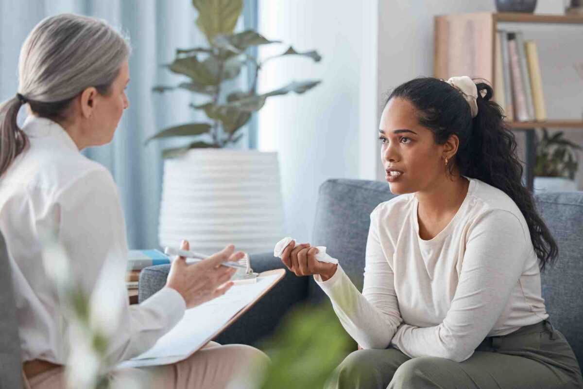 depression-treatment-therapy-session-pennsylvania Woman speaking with therapist during depression treatment session.