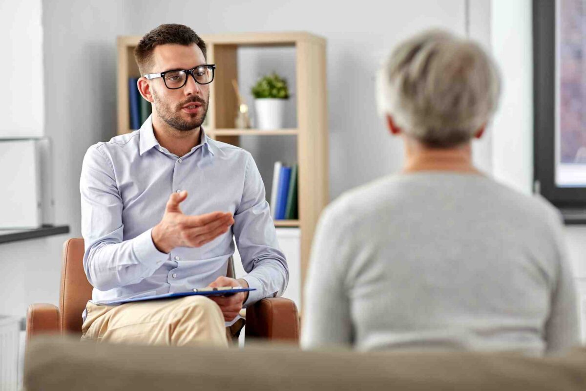 addiction-therapy-session Licensed therapist speaking with client during addiction treatment session
