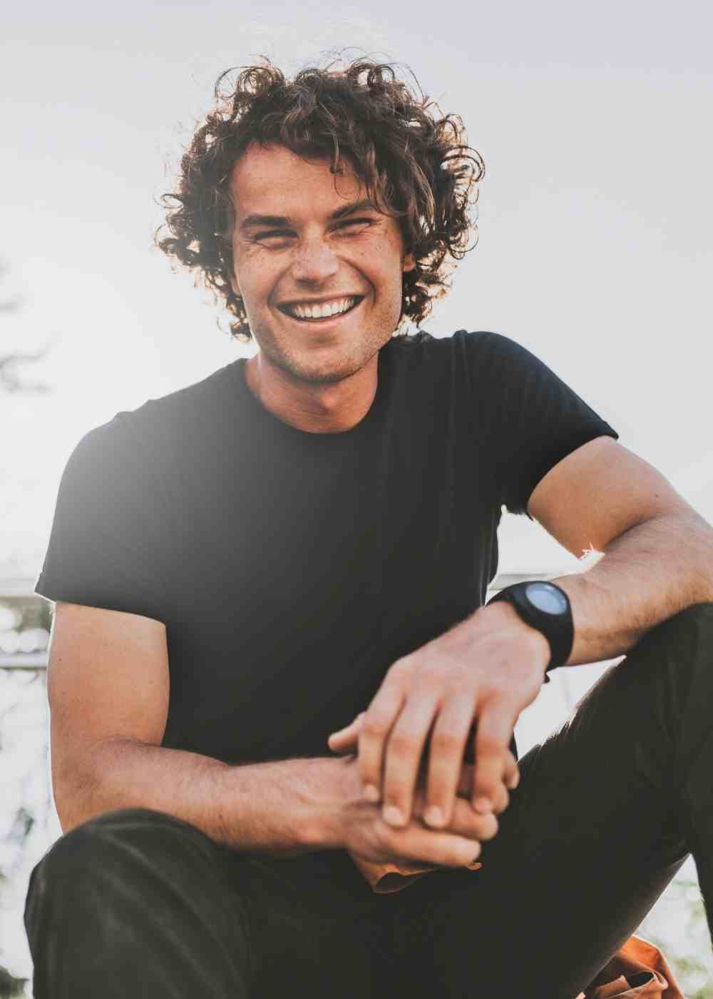 confidence-recovery-dbt-addiction Man smiling outdoors while finding support through Dialectical Behavioral Therapy in PA.