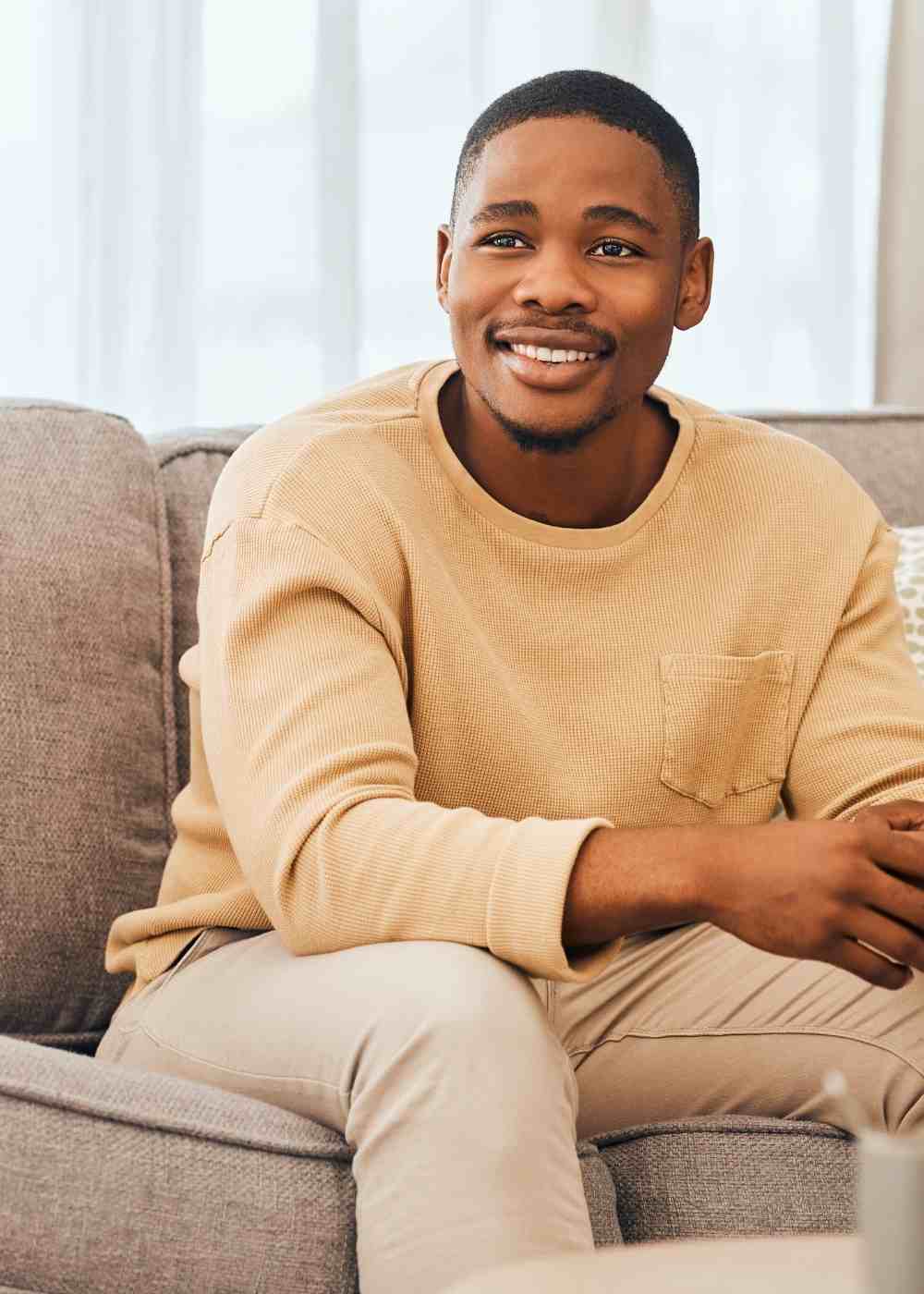 emotional-stability-dbt-addiction-recovery Man sitting on a couch during Dialectical Behavioral Therapy in PA.