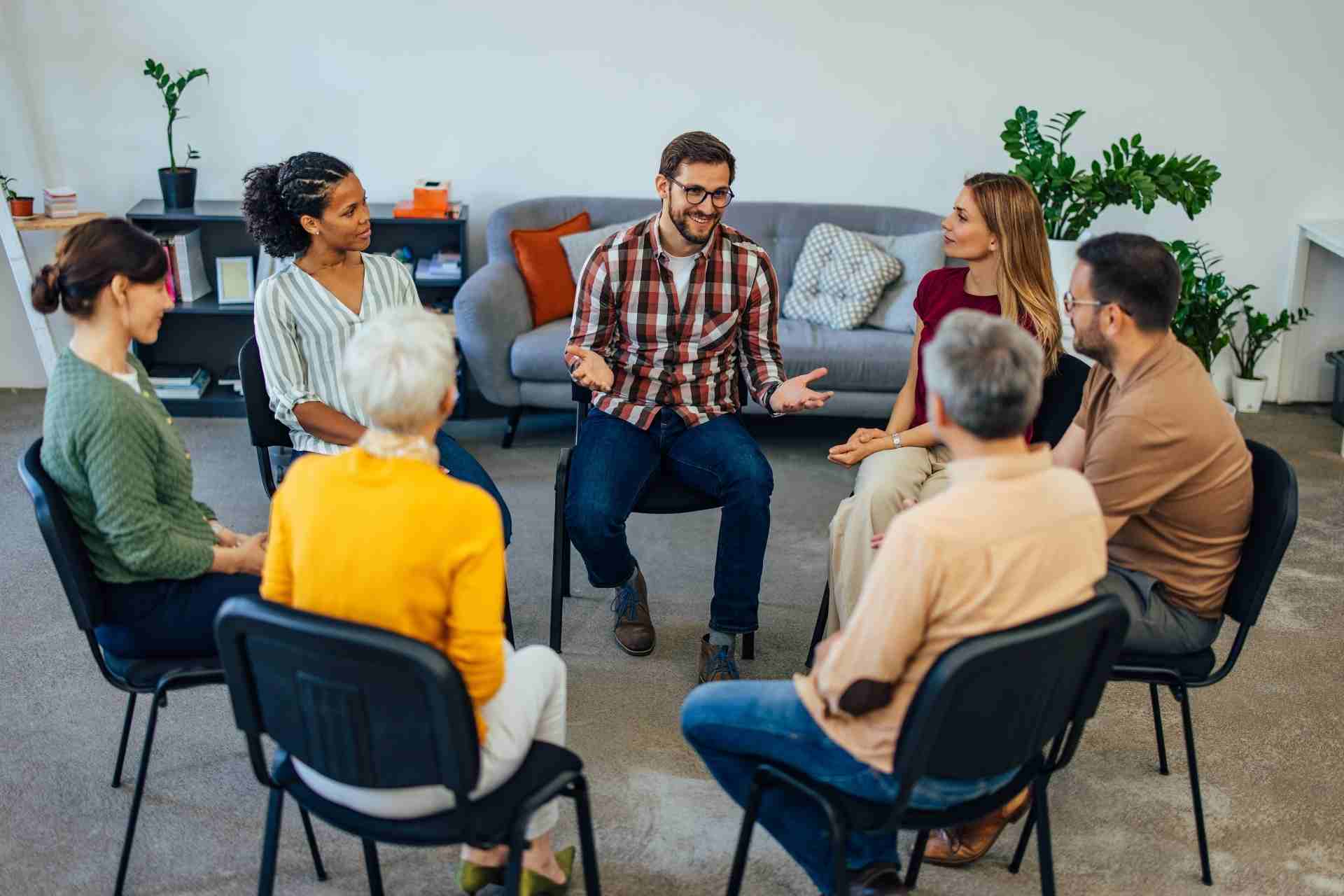 support-group-addiction-treatment-recovery Support group meeting for people in addiction treatment and recovery