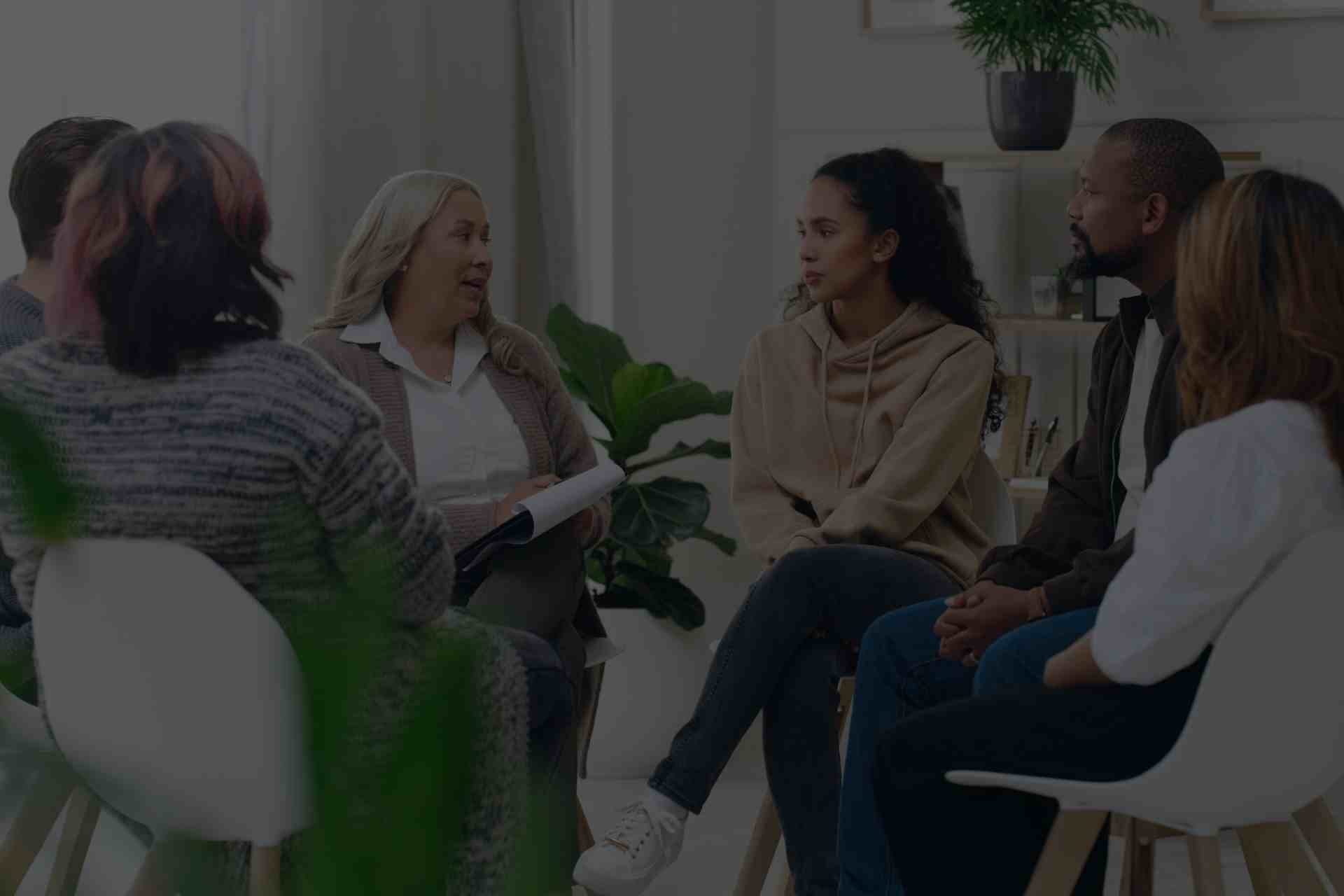 therapeutic-relationship-dbt-addiction-recovery Group therapy session with people discussing Dialectical Behavioral Therapy in PA.