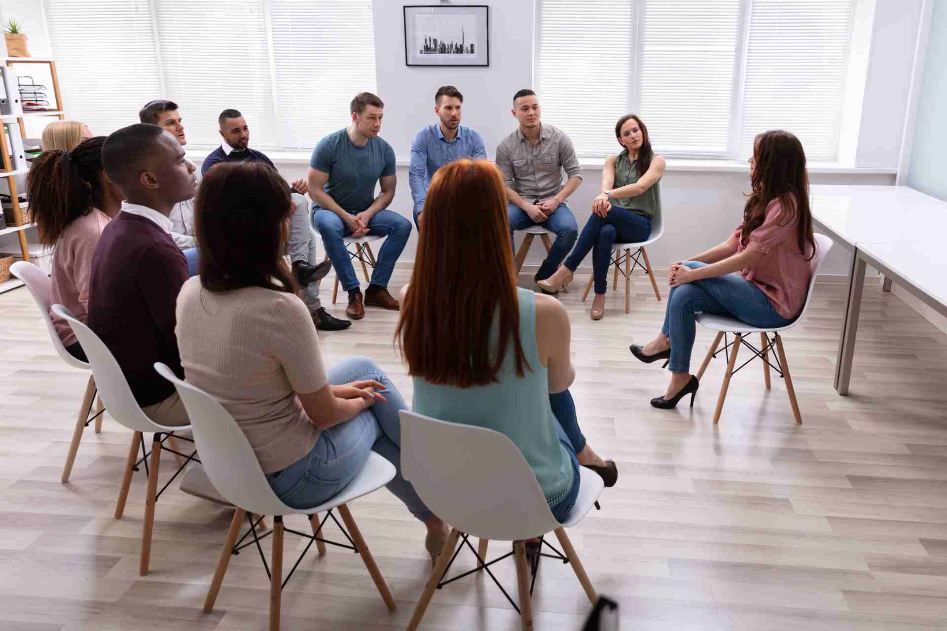 group-therapy-addiction-treatment-session Group therapy session for addiction treatment and mental health recovery
