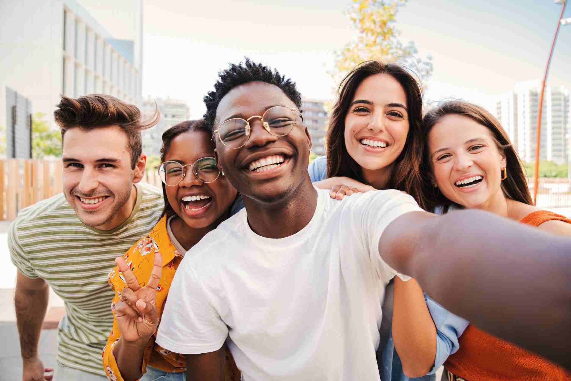 young-adults-addiction-recovery-community Diverse group of young adults smiling together during addiction recovery journey
