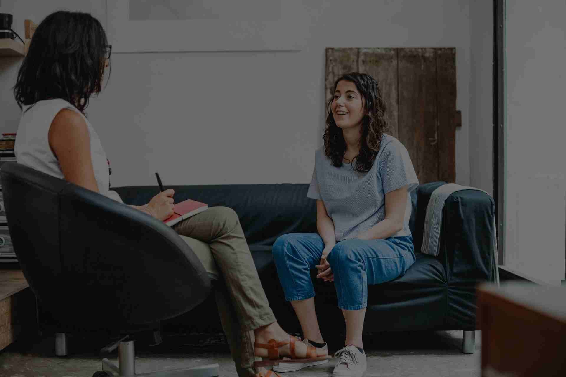 counseling-for-addiction-recover Group therapy session with people sharing support during Cognitive Behavioral Therapy for addiction recovery.