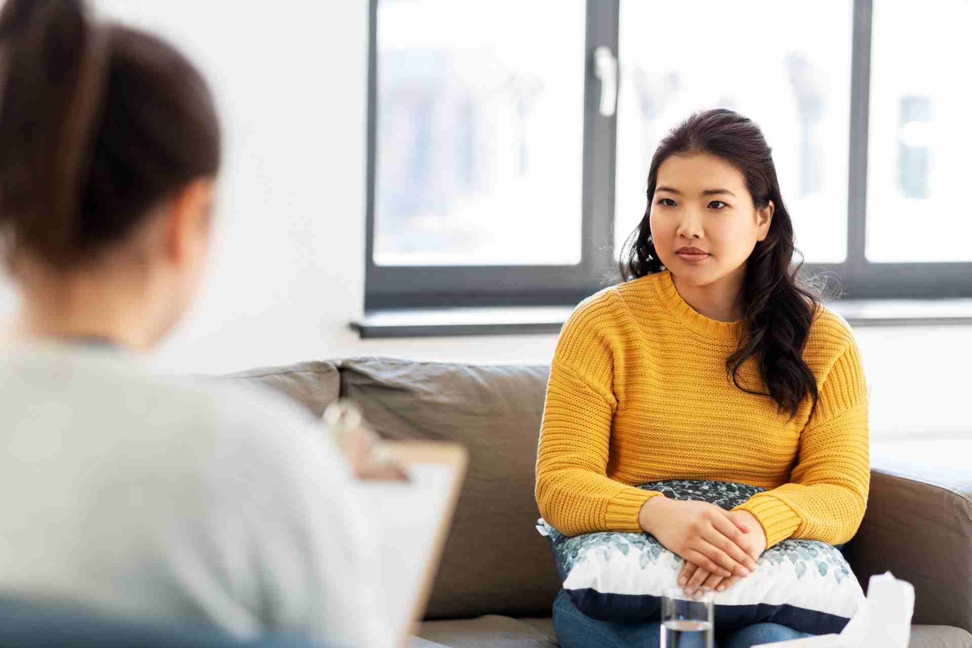 A client participating in an EMDR therapy session with a mental health therapist to address trauma and addiction recovery.