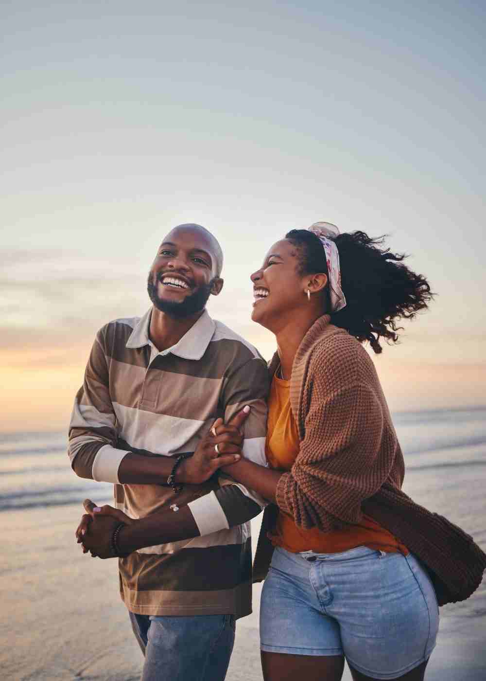 fentanyl-addiction-treatment-pennsylvania-couple-recovery Woman smiling with a mug while finding calm through Cognitive Behavioral Therapy for addiction recovery.